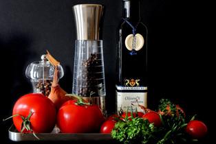 tomatoes, pepper grinder, and oil