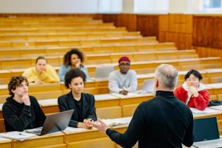 students listening to teacher